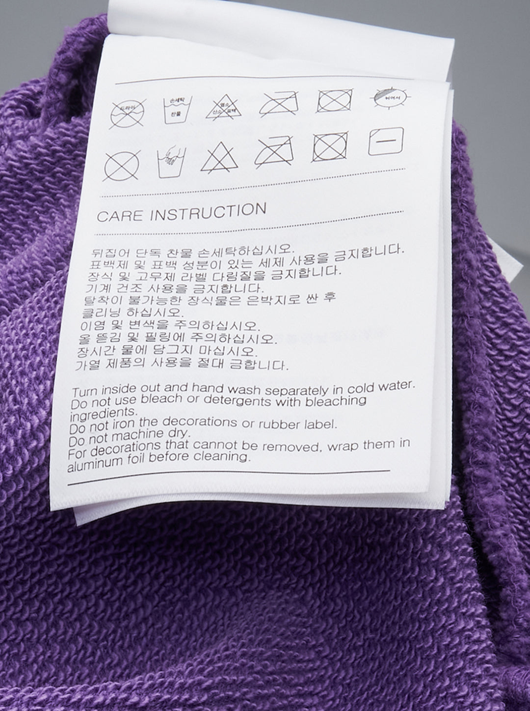 We11done Purple Anniversary Teddy Zip Hoodie with crayon-style teddy bear graphic, multicolour illustrative detailing, paint splatter, and bleach-wash distressing on an oversized silhouette - view 3