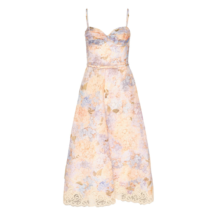 Zimmermann Valiant Tucked Midi Dress in a pastel hydrangea floral print, featuring a structured sweetheart bustier bodice, adjustable spaghetti straps, a self-belt at the waist, and an A-line skirt with ivory lace scrollwork trim at the hem