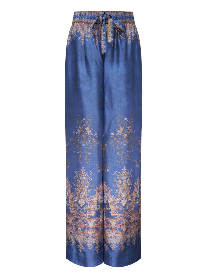 Zimmermann Valiant wide-leg pants in blue with ornate paisley and floral border print, elasticated drawstring waistband and decorative woven trim