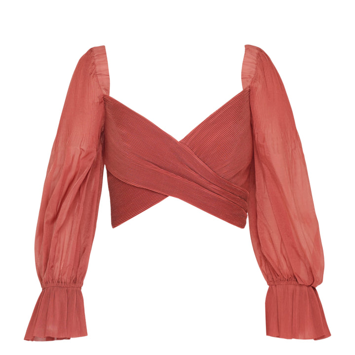 Zimmermann Pleated Bodice Wrap Top in terracotta, featuring a crossover pleated front, voluminous puff sleeves in crinkled woven fabric, and ruffled elasticated cuffs