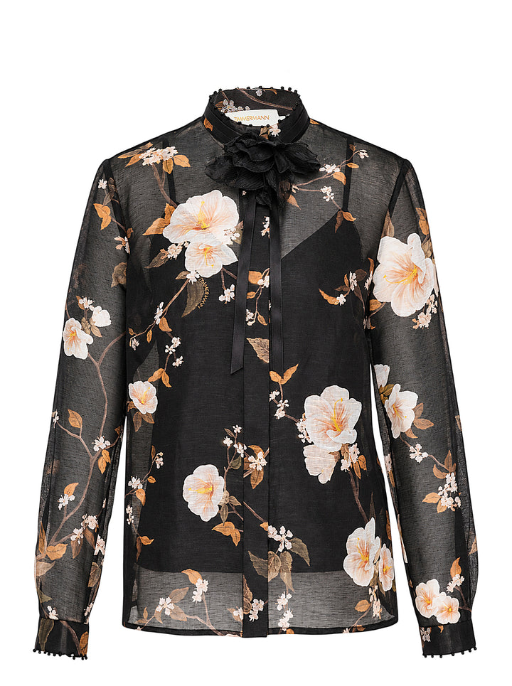 Zimmermann Ascent Embellished Body Shirt in sheer black floral print with ruffled bead-embellished collar, satin ribbon tie, and pom-pom trimmed cuffs