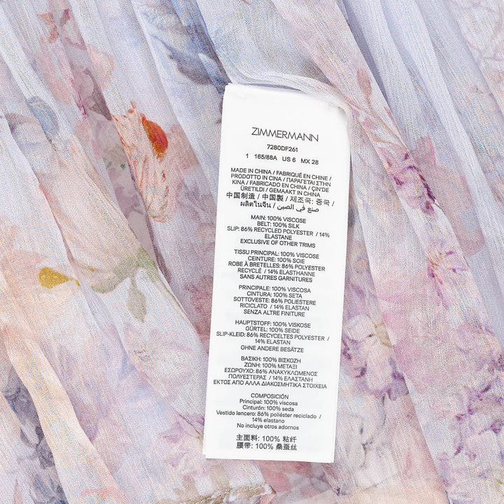 Zimmermann Valiant Flutter Midi Dress in pale blue with watercolour floral print, ruffled high neckline with tassel tie, flutter cap sleeves, printed sash belt, and tiered hem