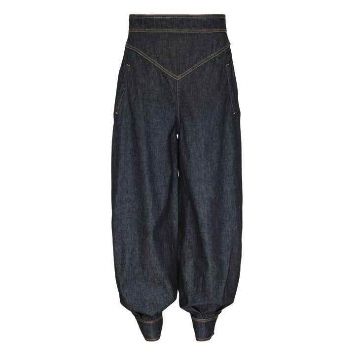 Zimmermann Denim Harem Pants in raw indigo with V-yoke high waist, voluminous balloon legs, gathered ankle cuffs, and contrast gold topstitching — front view on white background