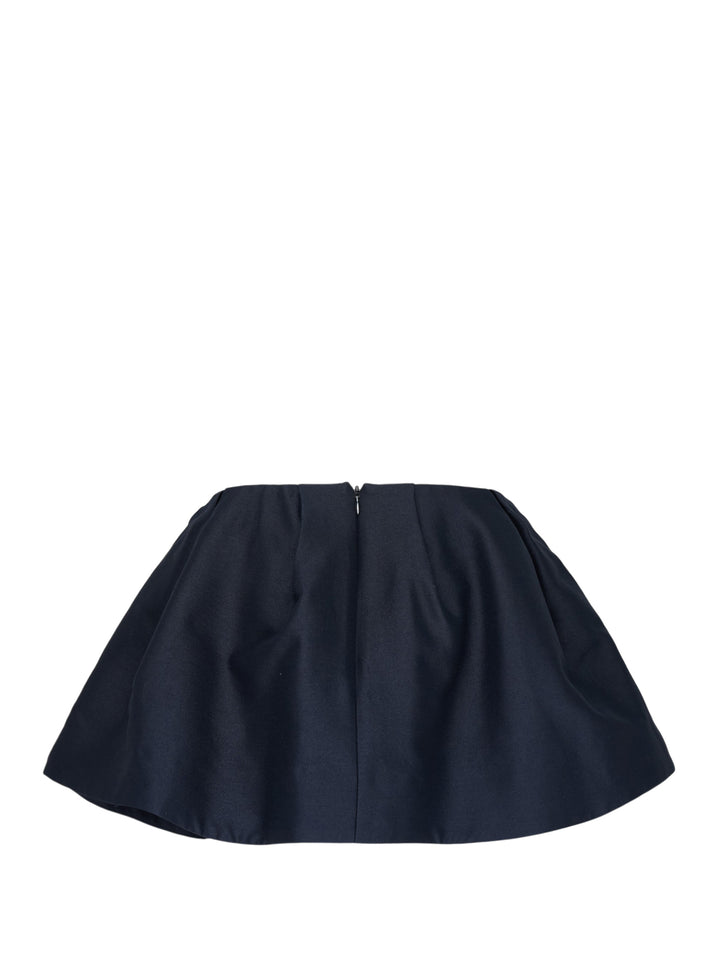 SHUSHU/TONG Pleated Mini Skirt in deep navy, featuring a fitted waistband, front pleat, and full voluminous flared hem, shown flat on a white background - view 2