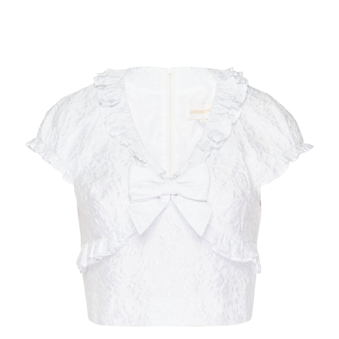 SHUSHU/TONG white jacquard ruffled bow crop top with puff sleeves, ruffle collar and hem trim, and structured satin bow at the centre front neckline, shown from the back