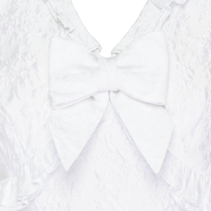 SHUSHU/TONG white jacquard ruffled bow crop top with puff sleeves, ruffle collar and hem trim, and structured satin bow at the centre front neckline, shown from the back