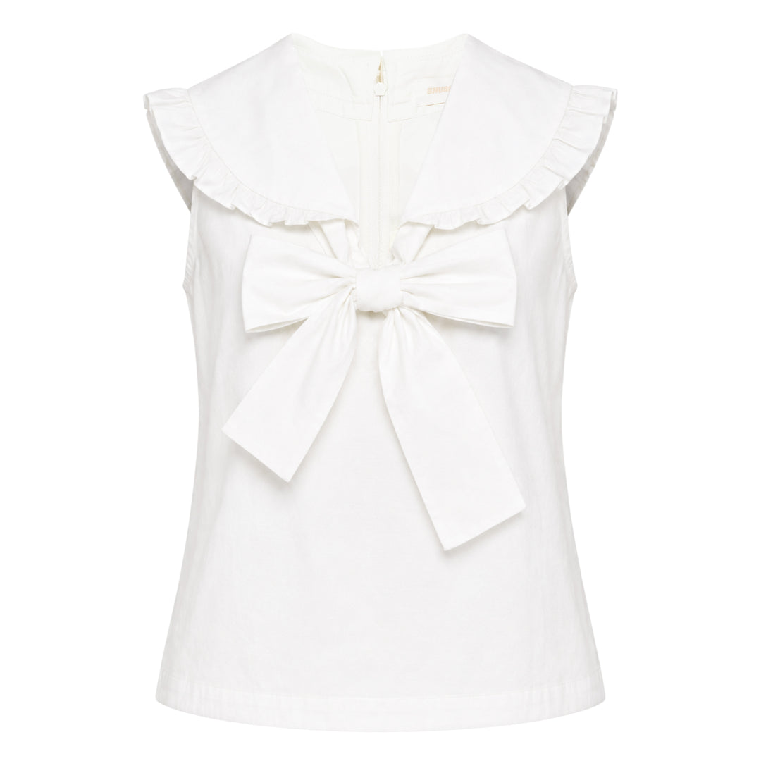 SHUSHU/TONG white sleeveless woven top with ruffled shawl collar and large oversized self-fabric bow at the centre front, photographed against a white background