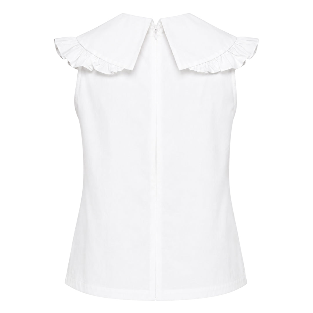 SHUSHU/TONG white sleeveless woven top with ruffled shawl collar and large oversized self-fabric bow at the centre front, photographed against a white background