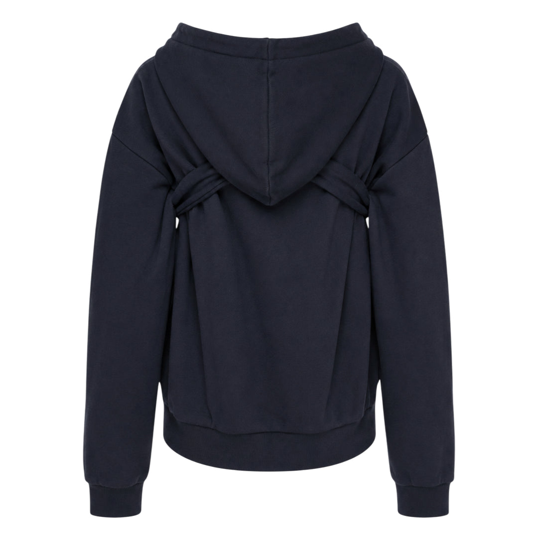 SHUSHU/TONG navy Tie Front Bow Hoodie with an oversized self-fabric bow at the waist, open V-neckline, and embroidered logo on the chest