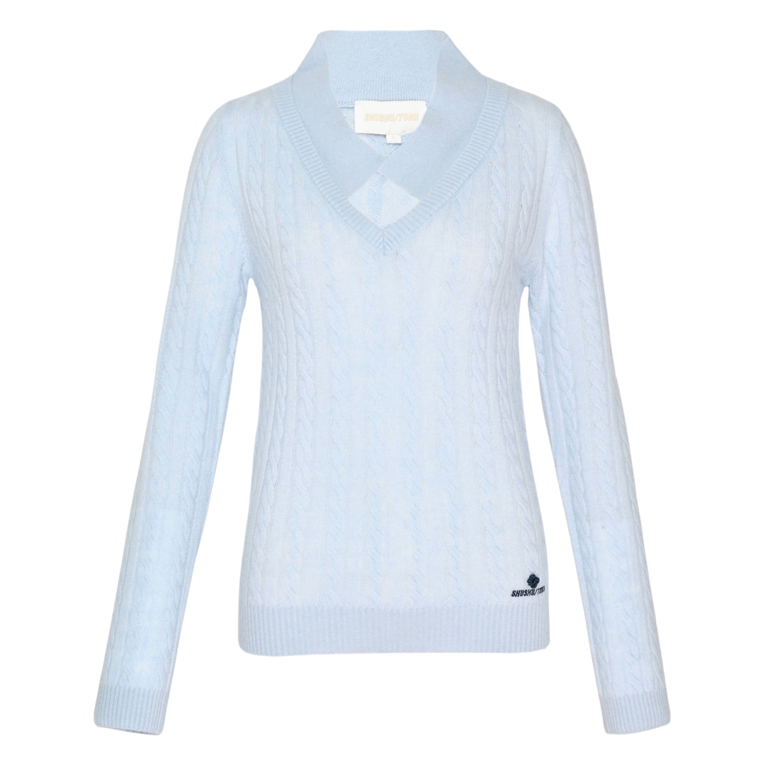 SHUSHU/TONG V-Neck Cable Knit Sweater in baby blue with open collar, all-over cable texture, and ribbed cuffs and hem