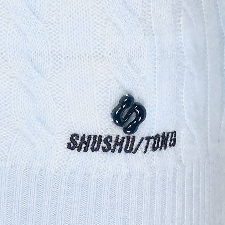 SHUSHU/TONG V-Neck Cable Knit Sweater in baby blue with open collar, all-over cable texture, and ribbed cuffs and hem