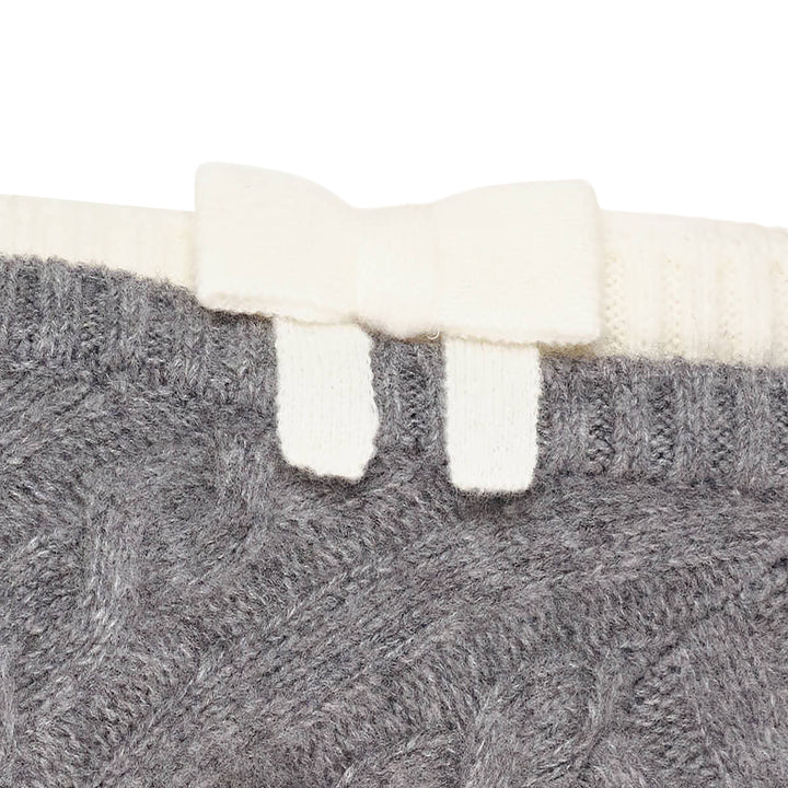 SHUSHU/TONG baby blue cable-knit off-shoulder crop top with cream contrast ribbed trim, bow accent at the neckline, and short sleeves, displayed flat on a white background