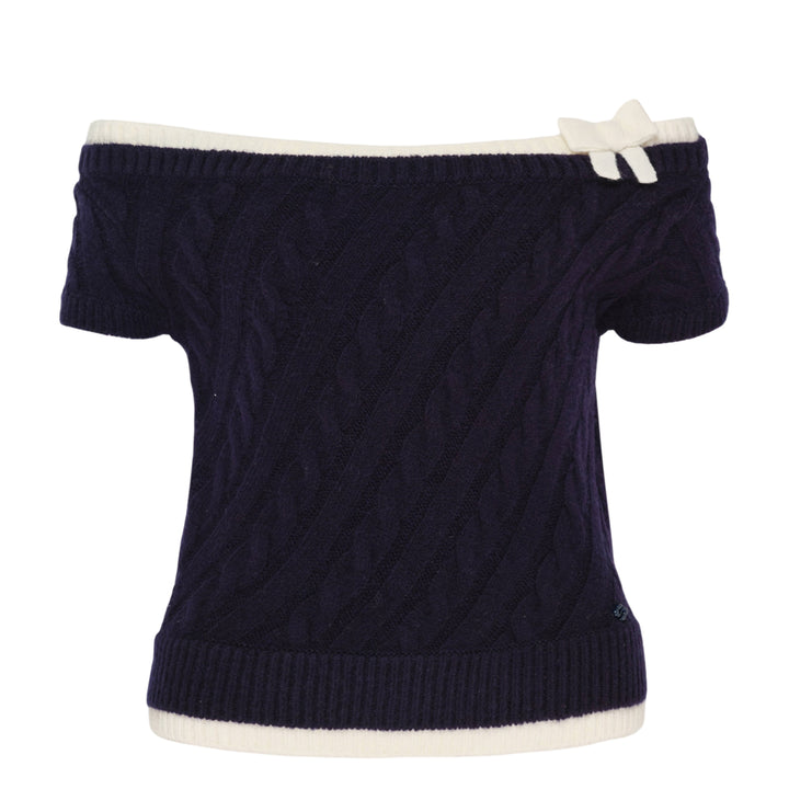 SHUSHU/TONG baby blue cable-knit off-shoulder crop top with cream contrast ribbed trim, bow accent at the neckline, and short sleeves, displayed flat on a white background