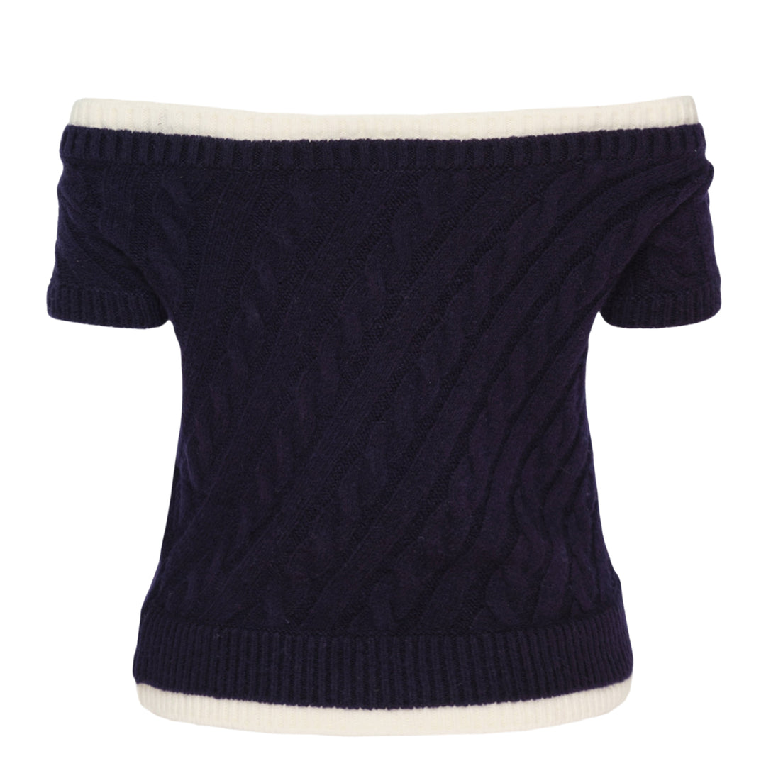 SHUSHU/TONG baby blue cable-knit off-shoulder crop top with cream contrast ribbed trim, bow accent at the neckline, and short sleeves, displayed flat on a white background