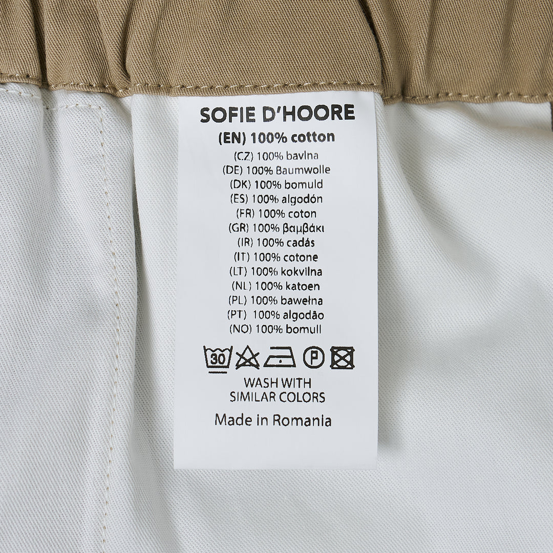Sofie D'Hoore Elastic Low Crotch Pants in khaki, displayed flat — wide-leg silhouette with elasticated waistband and single button fastening