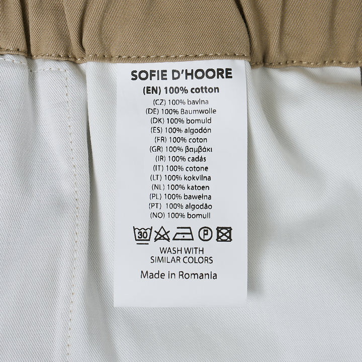 Sofie D'Hoore Elastic Low Crotch Pants in khaki, displayed flat — wide-leg silhouette with elasticated waistband and single button fastening