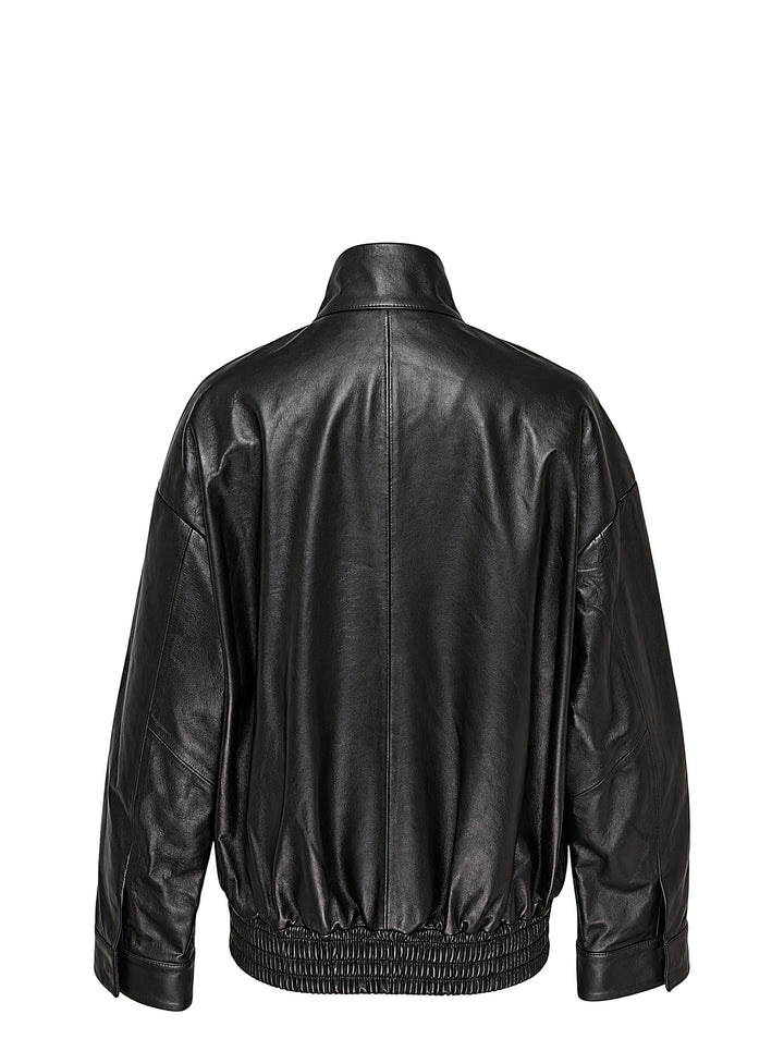 Musée RA oversized black leather bomber jacket with funnel collar, flap pockets and smocked elasticated hem, front view - view 2