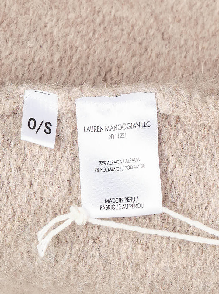Lauren Manoogian Long Shawl Cardigan in heathered oatmeal, laid flat showing open-front silhouette, wide shawl collar, hip pockets, and woven brand label - view 3