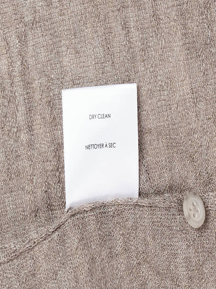 Lauren Manoogian Fine Henley knit top in heathered taupe with short sleeves, a round neck, and a partial button placket, shown flat on a white background - view 4