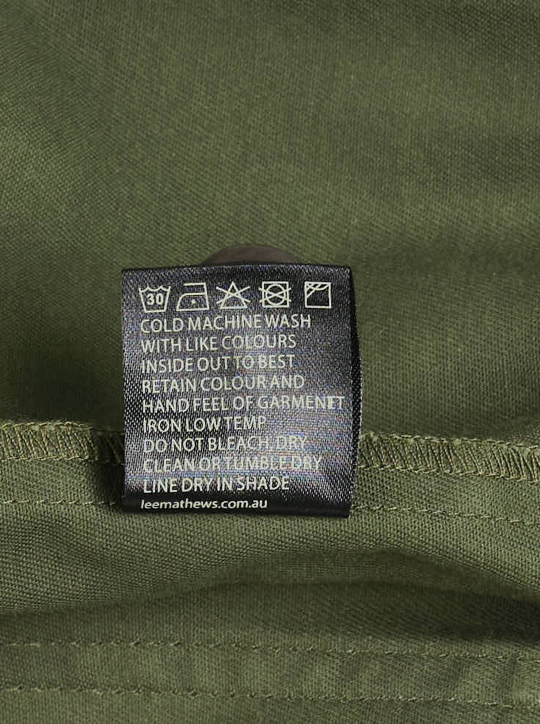 Lee Mathews Harper Drill Utility Jacket in washed khaki cotton drill, featuring a stand collar, button-through placket, drawstring waist, and large flap hip pockets - view 3