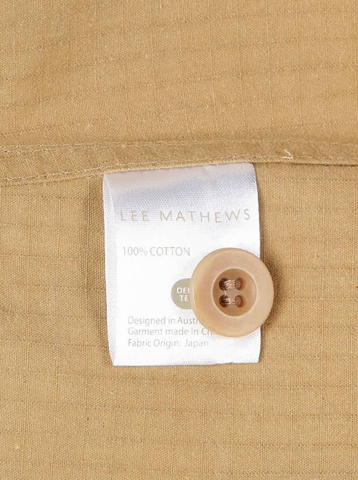 Lee Mathews Cecil Cotton Top in camel — sleeveless A-line woven top with fine stripe texture, centre seam, panel detailing, and back zip closure, shown front view - view 3