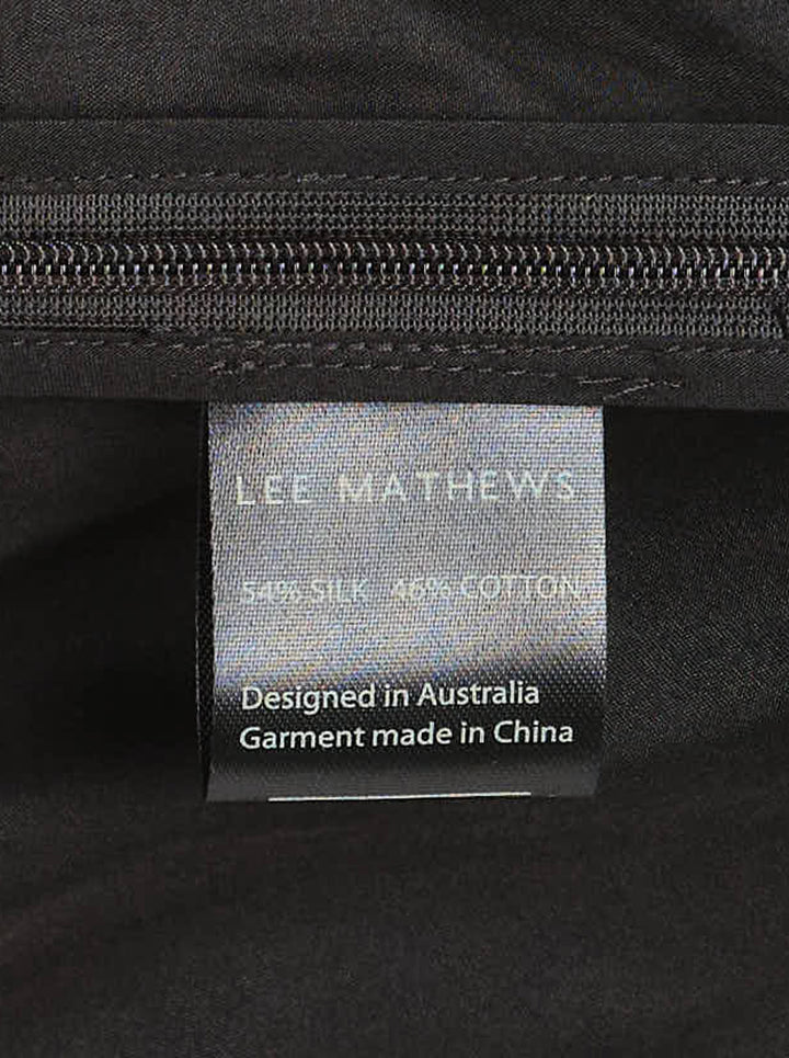 Lee Mathews Nina Silk Twist Top in black, featuring an asymmetric one-shoulder neckline and diagonal ruched twist draping across the body - view 3