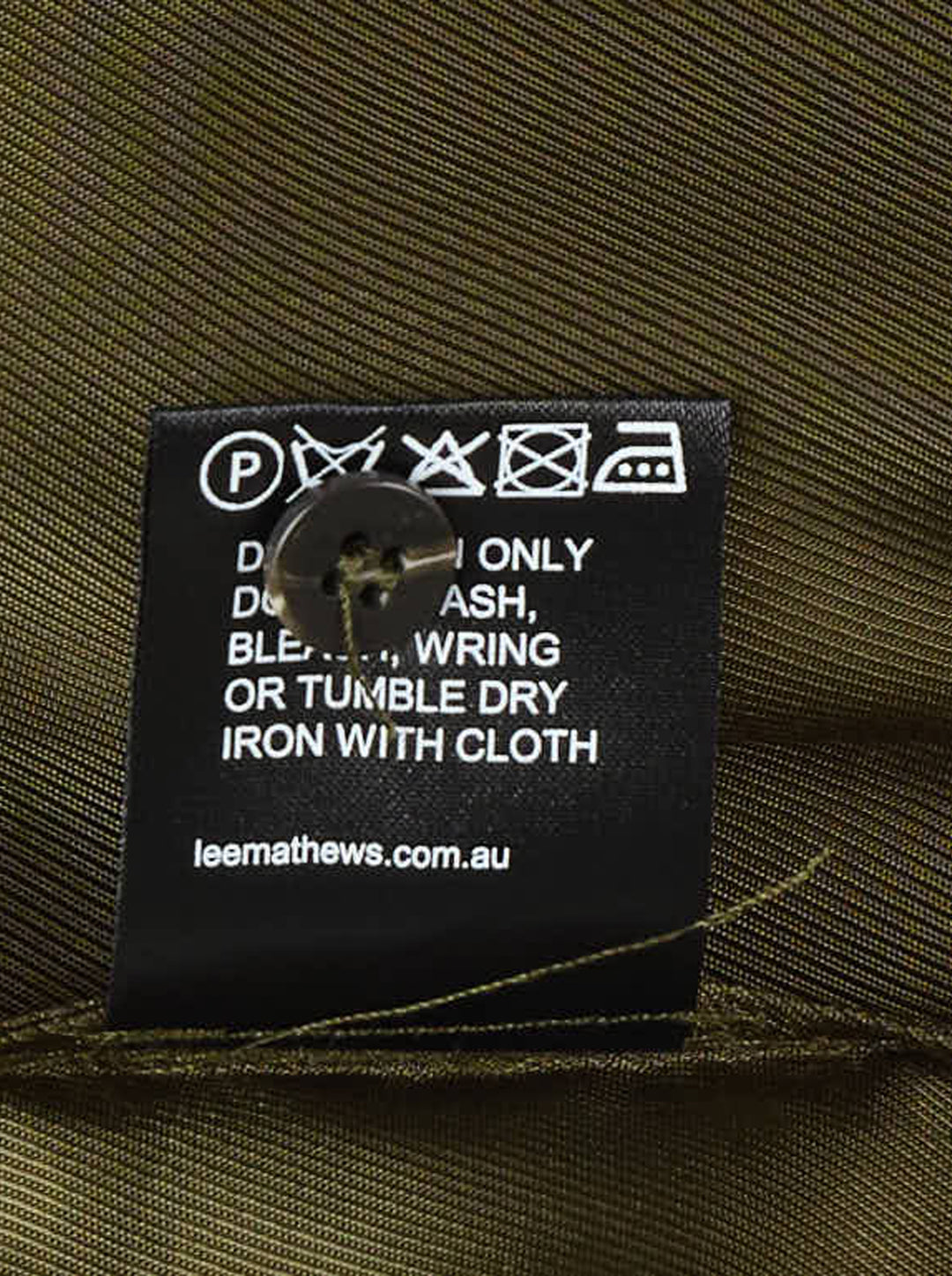 Lee Mathews Sloane Short Sleeve Shirt in olive green with white contrast topstitching, two patch chest pockets, and button-through front placket, displayed flat on white background - view 3