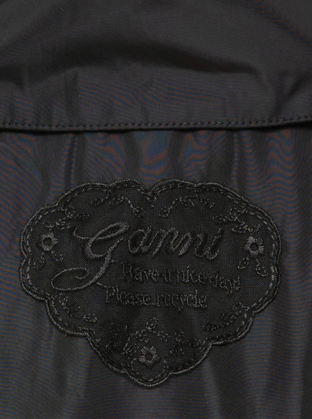 Ganni Flyweight Nylon Mini Utility Dress in black, featuring a camp collar, tonal snap button placket, oversized chest cargo pockets, and a gathered tiered flared skirt - view 3