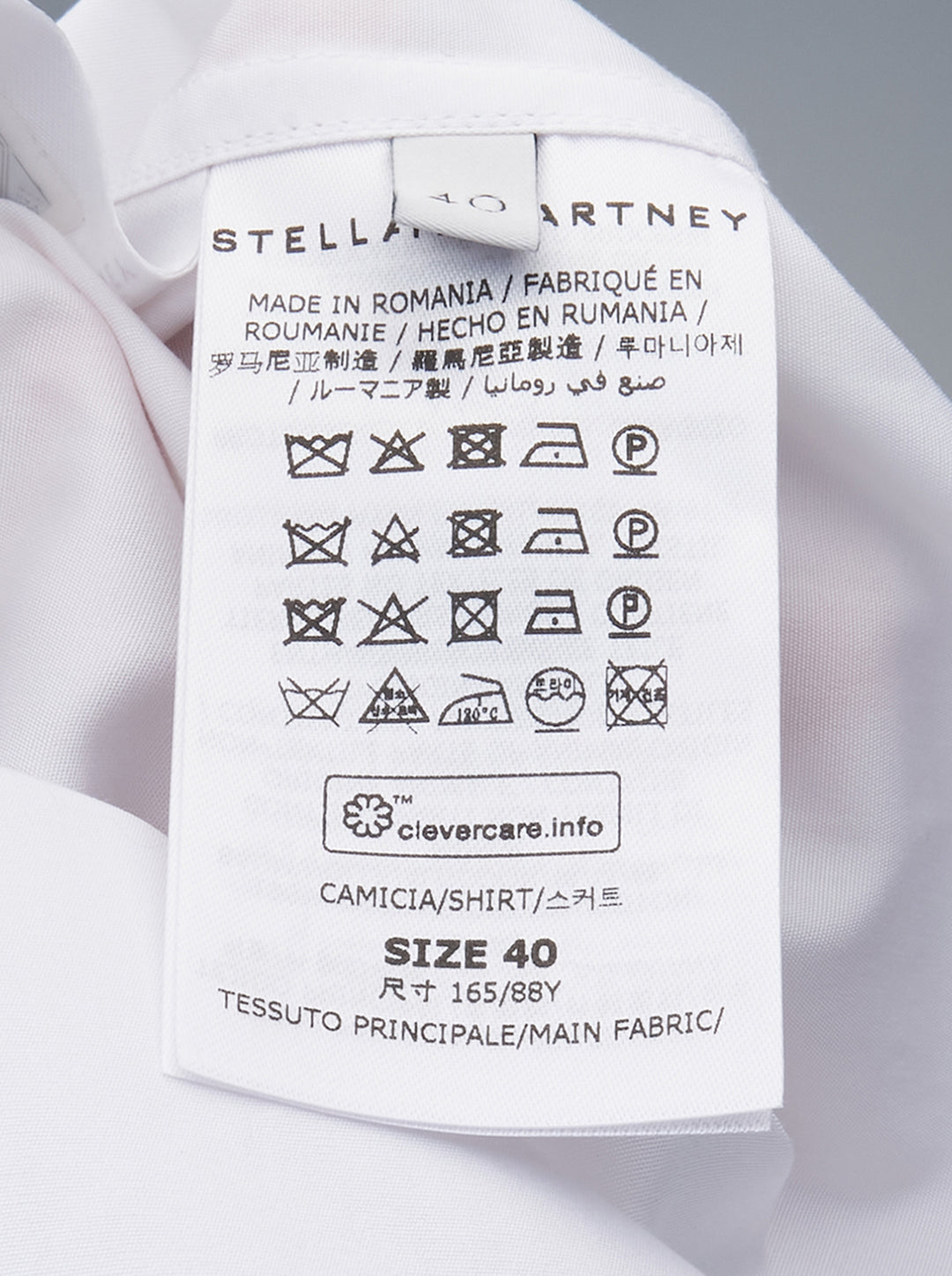 Stella McCartney white cotton poplin open-back shirt with classic pointed collar, full-length button front fastening, long sleeves, and buttoned cuffs - view 3