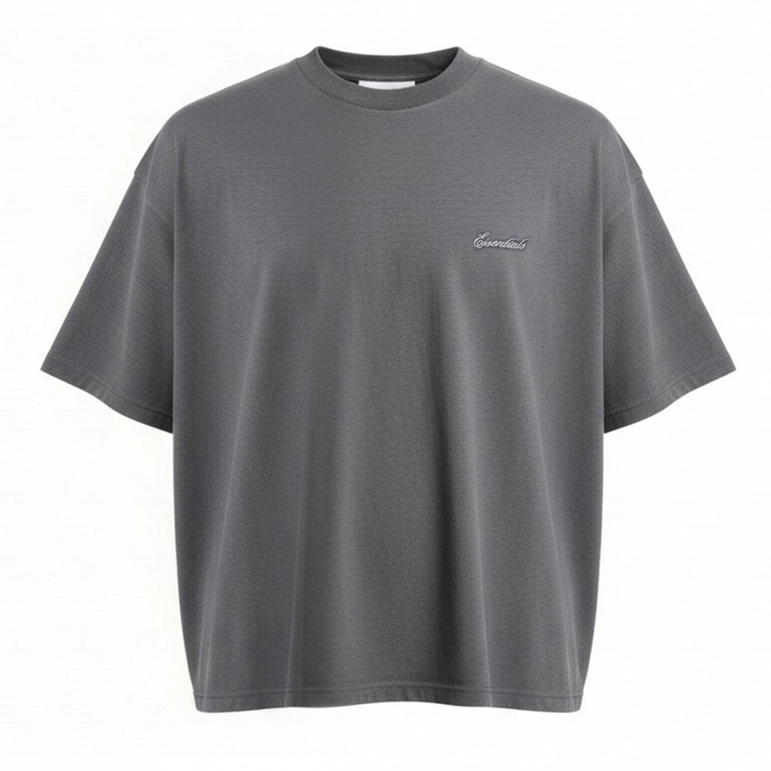 Fear of God Essentials Signature Short Sleeve Tee in washed grey, featuring an oversized boxy silhouette, ribbed crewneck, and tonal script logo at the chest