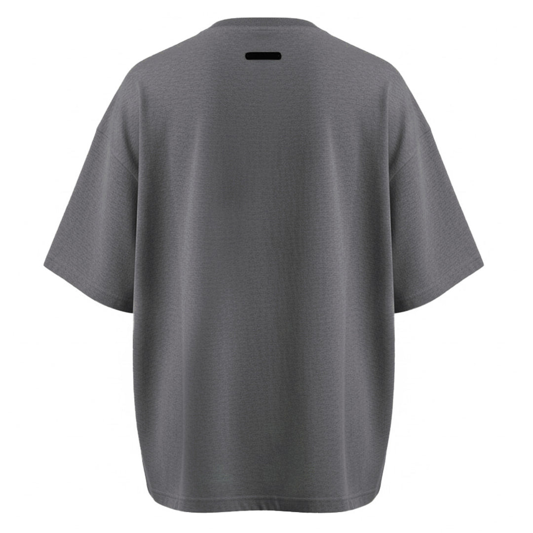 Fear of God Essentials Signature Short Sleeve Tee in washed grey, featuring an oversized boxy silhouette, ribbed crewneck, and tonal script logo at the chest - view 2