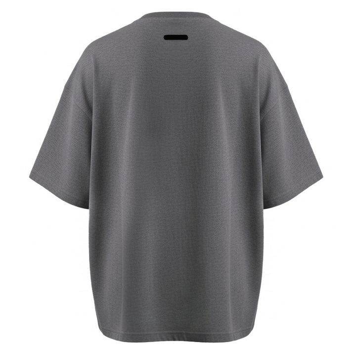 Fear of God Essentials Signature Short Sleeve Tee in washed grey, featuring an oversized boxy silhouette, ribbed crewneck, and tonal script logo at the chest - view 2