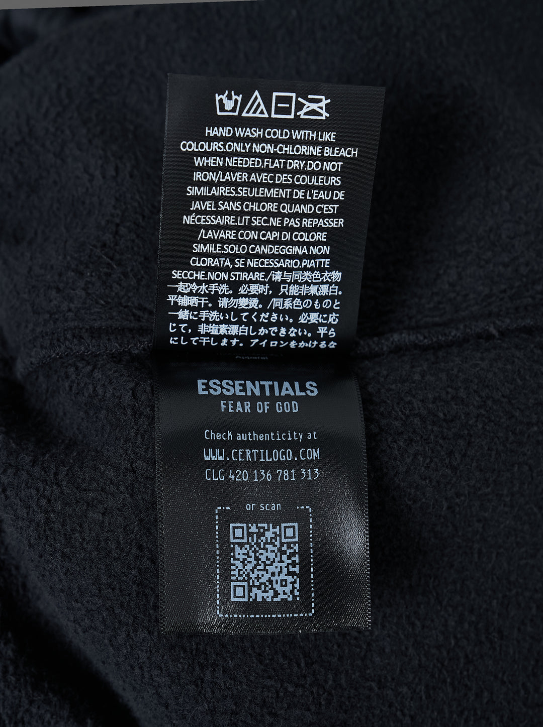 Fear of God Essentials washed black fleece shorts with drawstring waist and beige 'fog' logo print at the hem - view 4