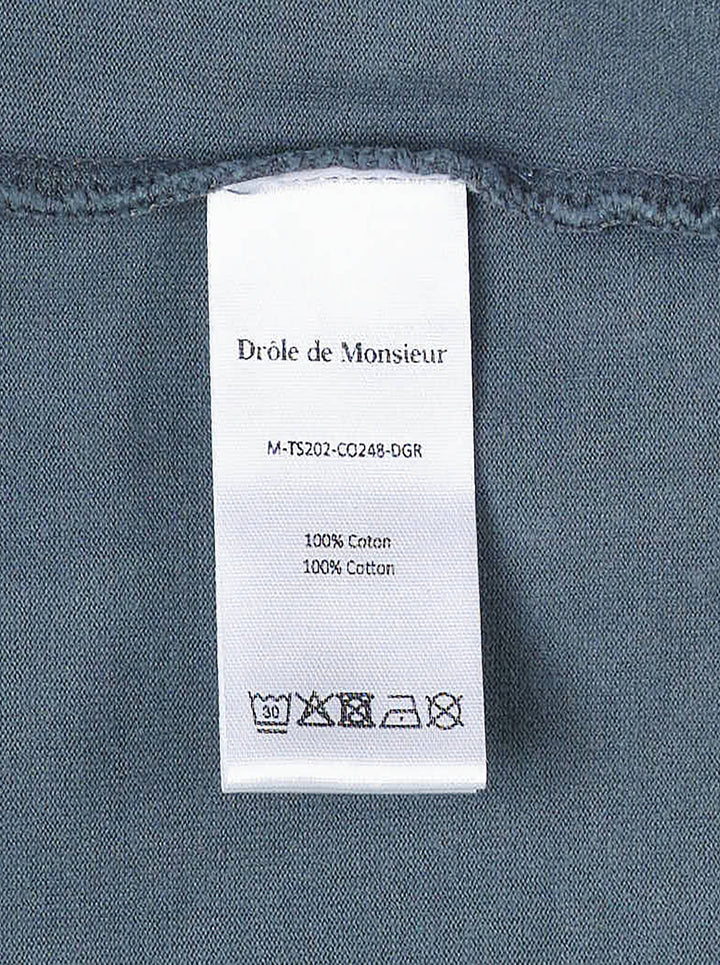 Drôle de Monsieur Classic Slogan Tee in washed slate blue with 'Not From Paris Madame' chest print, relaxed boxy fit, short sleeves, and ribbed crew neck - view 4