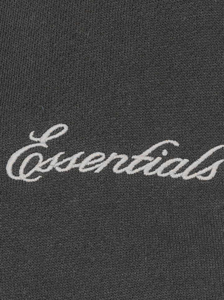 Fear of God Essentials women's modern cropped zip hoodie in washed black with embroidered script Essentials logo on the chest and front hand pockets - view 3