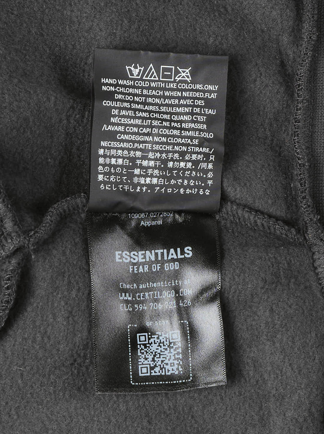 Fear of God Essentials women's modern cropped zip hoodie in washed black with embroidered script Essentials logo on the chest and front hand pockets - view 6