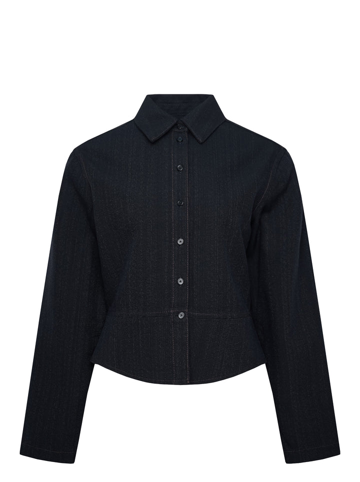Alaïa Basque Shirt Wool Denim jacket in dark indigo, featuring a point collar, concealed button-front placket, structured basque waist seam, tonal contrast stitching, and a cropped curved hem — front view on white background