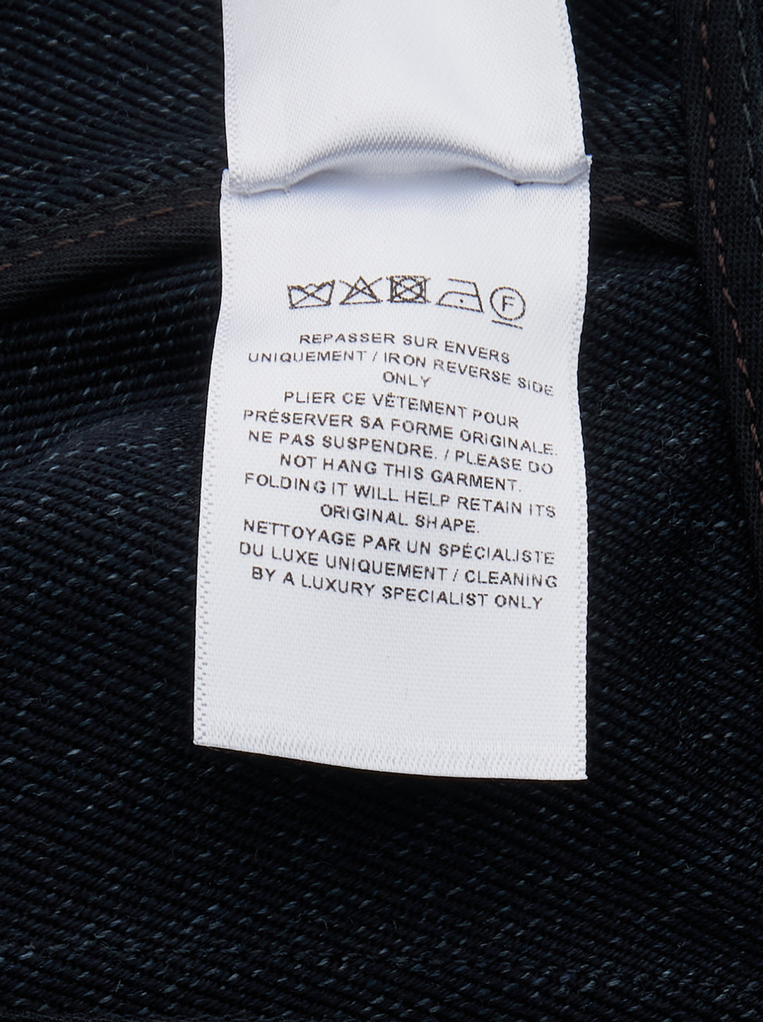 Alaïa Basque Shirt Wool Denim jacket in dark indigo, featuring a point collar, concealed button-front placket, structured basque waist seam, tonal contrast stitching, and a cropped curved hem — front view on white background - view 3