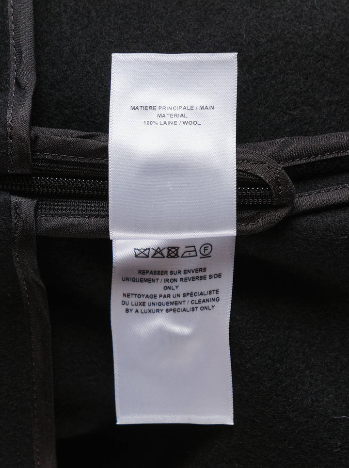 Alaïa light felted wool skater skirt in black, featuring a high wide waistband and full flared circle hem, displayed as a flat product shot on a white background - view 3