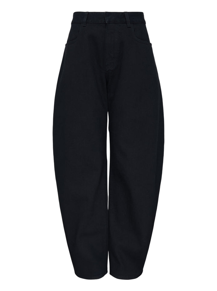 Alaïa round black denim jeans with a high waist and sculpted curved leg, shown front view