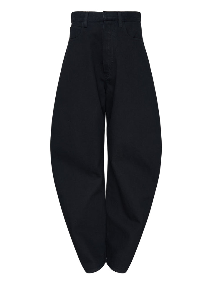 Alaïa black denim round pants with a high waist, five-pocket design and sculpted curved leg, shown from the front