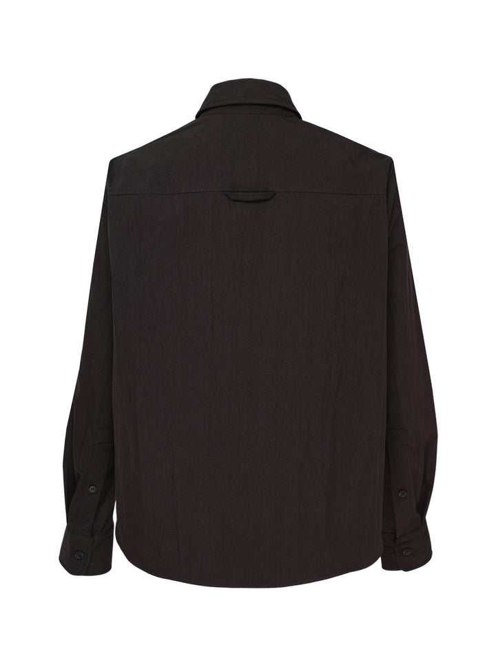 Melitta Baumeister Circle Shirt in black, featuring an asymmetric curved button placket, point collar, chest patch pocket, and structured long sleeves with wide cuffs - view 2