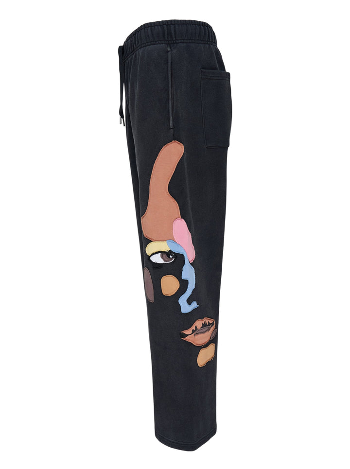 KidSuper Studios Side Eye Face washed black sweatpants with colourful patchwork appliqué face and drawstring waist - view 3