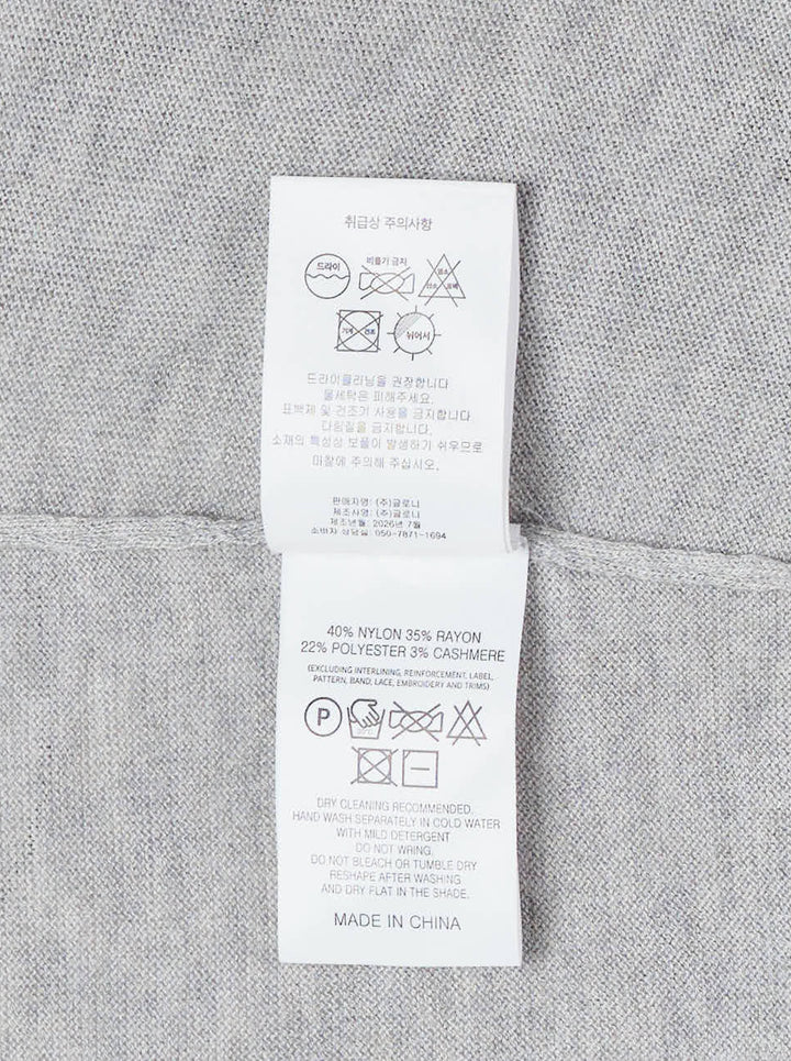 Glowny Nest Polo Mini Dress in grey marl knit with a ribbed polo collar, three-button placket, drawstring waist, and a navy pleated skirt panel with lace hem trim - view 3