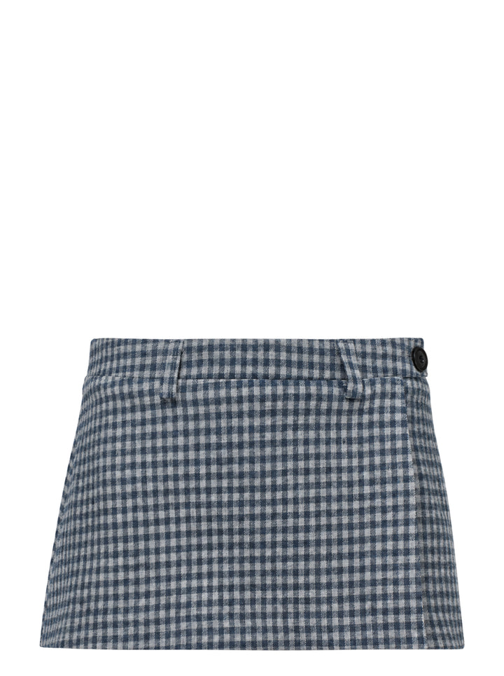 Glowny Polly Wrap Skorts in navy and white gingham check, showing structured waistband with button fastening and welt back pocket, laid flat on white background