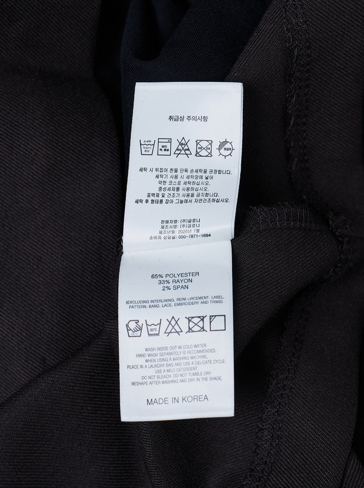 Glowny Polly Wrap Skorts in black, featuring a wrap-front A-line mini silhouette with structured waistband, belt loops, and button fastening - view 3