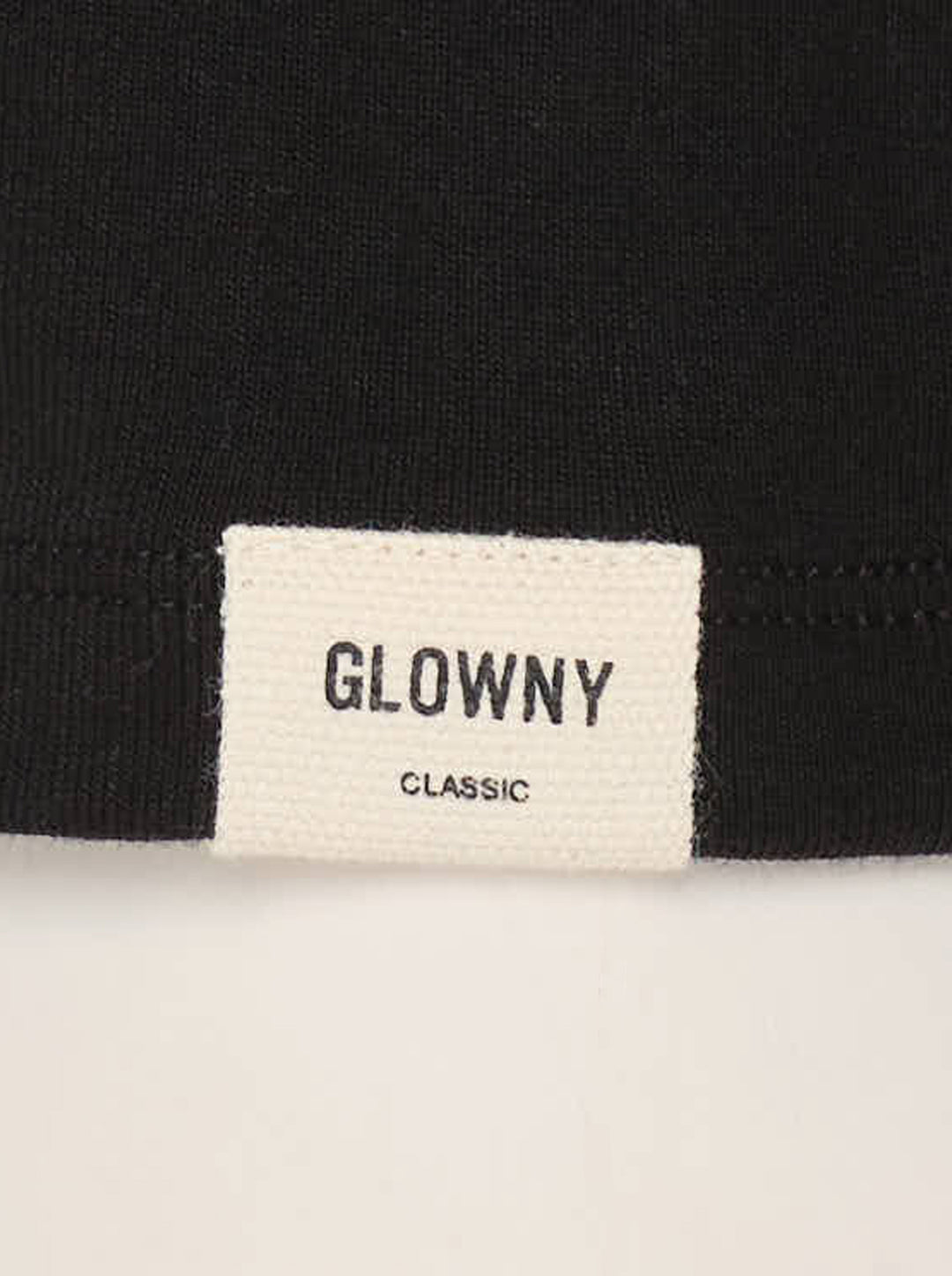 Glowny Long Sleeve Button Tee in black, featuring a short tonal button placket at the neckline, ribbed round collar, and a fitted jersey silhouette with woven brand label at the hem - view 5
