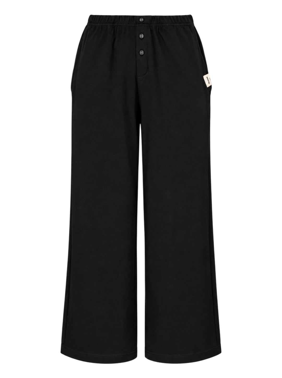 Glowny Button Fly Wide Leg Pants in black, featuring an elasticated waistband, three-button fly placket, wide-leg silhouette, and woven brand label tab at the hip