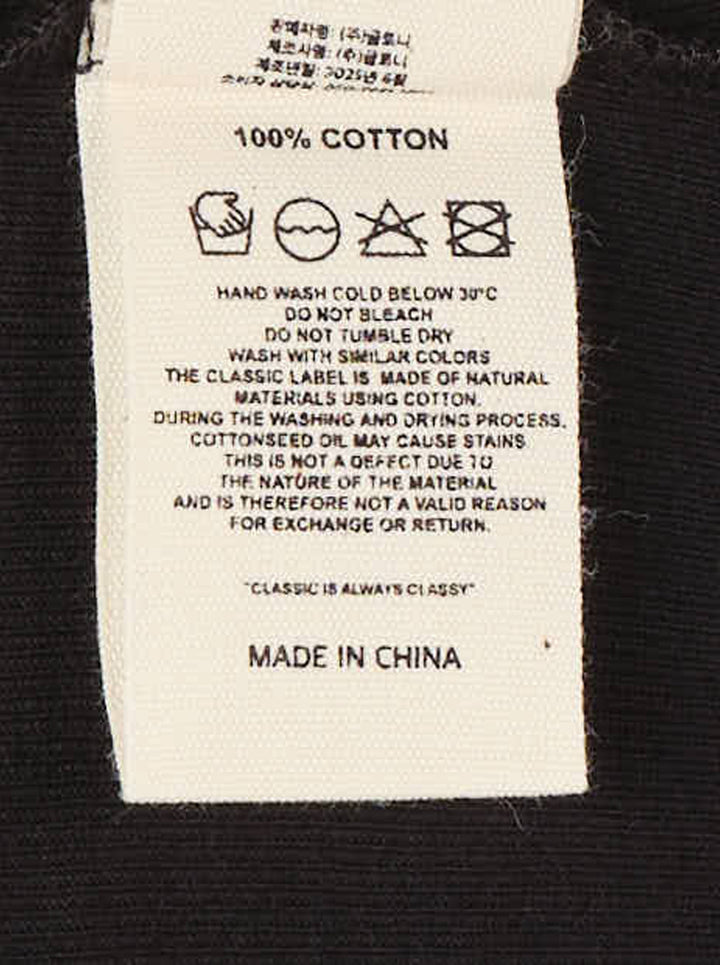 Glowny Classic Baby Tee in black — slim-fit cropped silhouette with a ribbed crew neck, short sleeves, and a woven Glowny label at the hem - view 3
