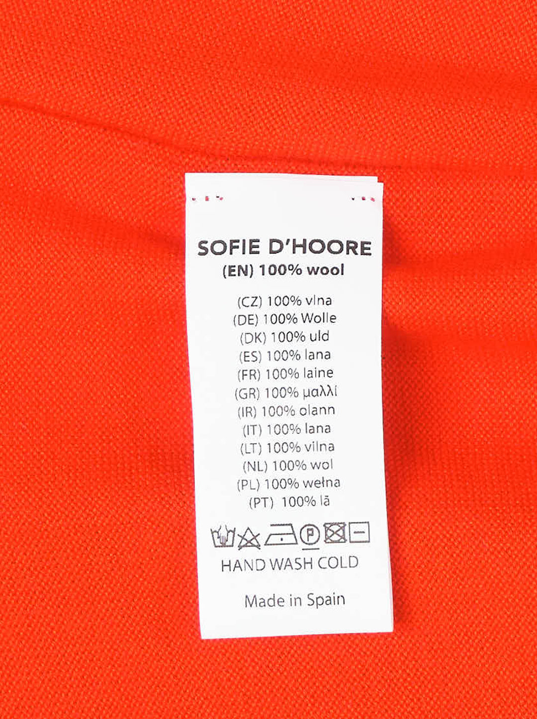 Sofie D'Hoore sleeveless crew neck knit top in bright red-orange with ribbed collar and knotted shoulder details, shown from the front - view 3